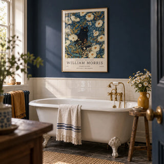 Black Cat Art Print, framed on the wall of a heritage bathroom with a navy painted wall and plain white tiles below