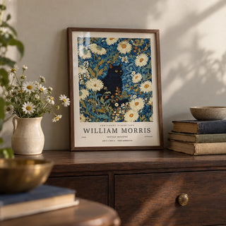 Black Cat Art Print, a small A4 framed print leaning on a dark wood sideboard in a living room