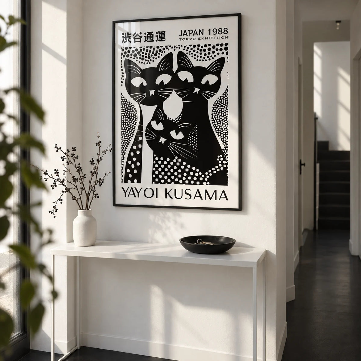 Black Cat Poster Art, framed on the wall of a crisp hallway with a white wall and a plain black floor