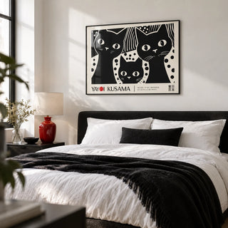 Black Cat Wall Art, framed on the wall of a crisp monochrome bedroom with a white wall