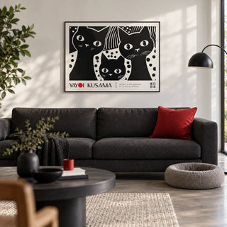 Black Cat Wall Art, framed on the wall of a design-led living room with a white wall and a polished concrete floor