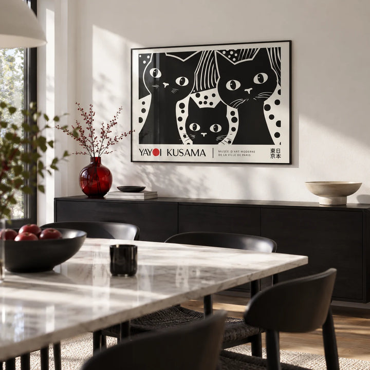 Black Cat Wall Art, framed on the wall of a modern dining room with a white wall