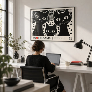 Black Cat Wall Art, framed on the wall of a monochrome home office with a white wall