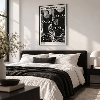 Black Cats Poster, framed on the wall of a crisp monochrome bedroom with a white wall
