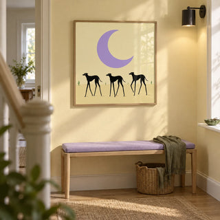 Black Dog Art Print, framed on the wall of a bright hallway in a renovated terraced house with pale warm yellow walls
