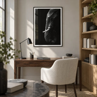 Black Elephant Wall Art, framed on the wall of a quiet home study with a pale grey wall and built-in oak shelves