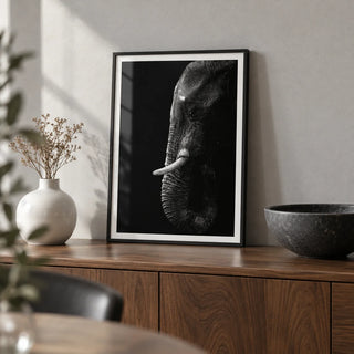 Black Elephant Wall Art, a small A4 framed print leaning on a walnut sideboard in a living room