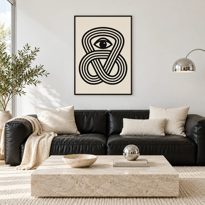Black Eye Poster, framed on the wall of a black and cream living room