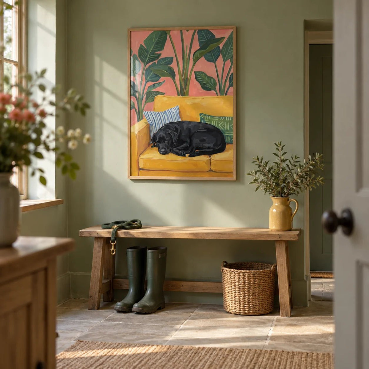 Black Lab Wall Art, framed on the wall of a country boot room with a sage green painted wall in a hallway