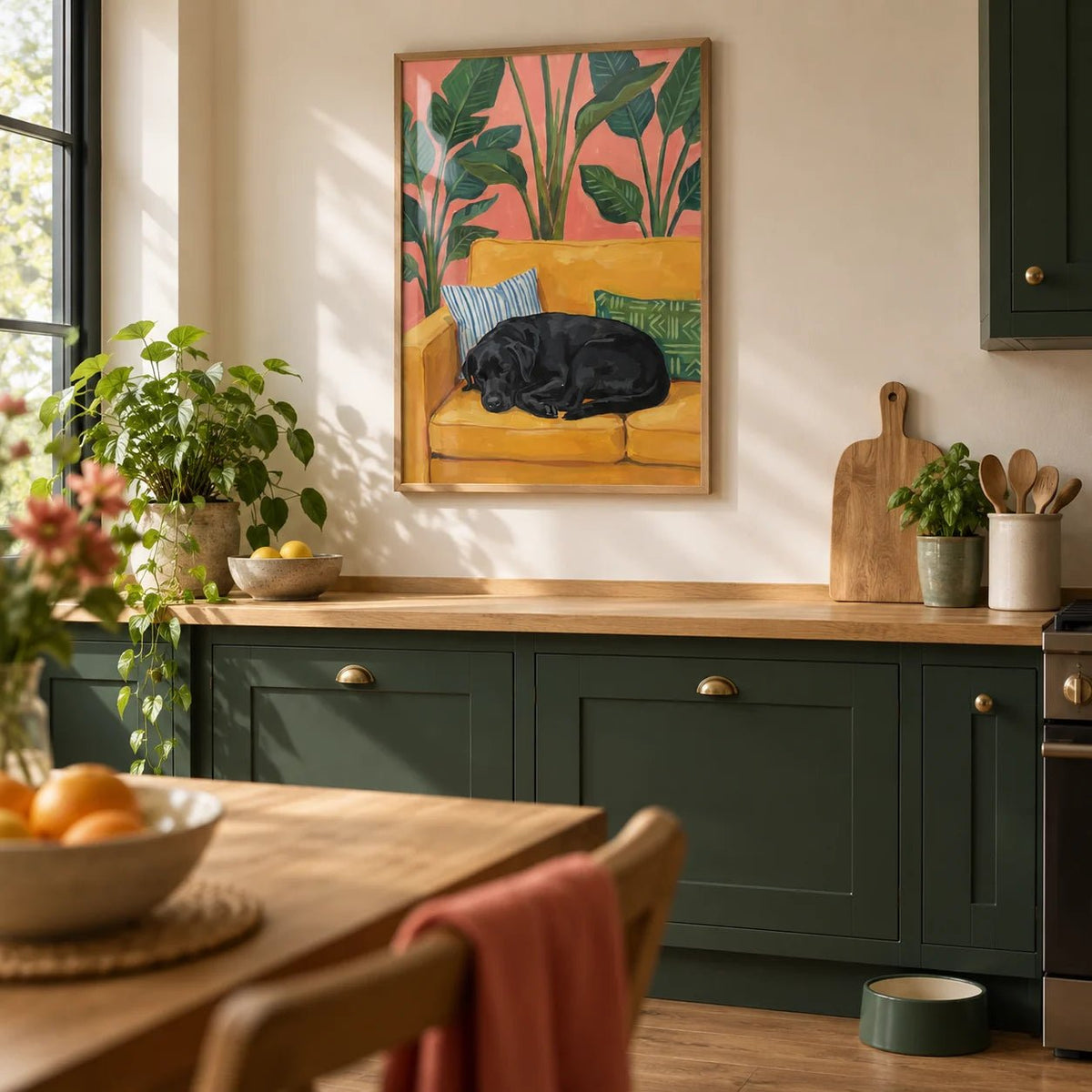 Black Lab Wall Art, framed on the wall of a family kitchen with deep green painted cabinets