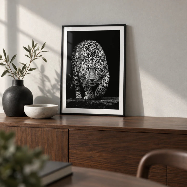 Black Leopard Wall Art, a small A4 framed print leaning on a walnut sideboard in a living room