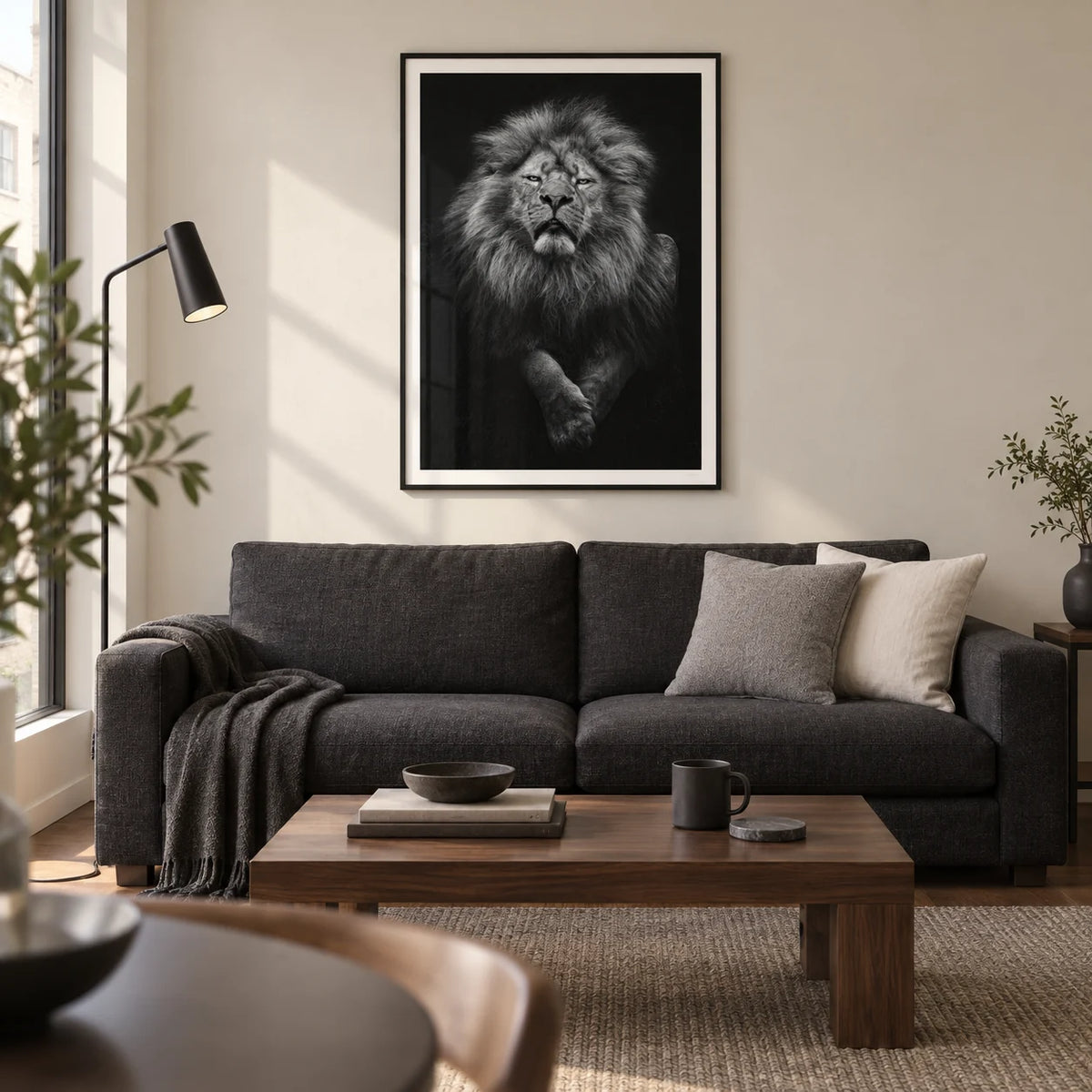 Black Lion Art Print, framed on the wall of a contemporary living room in a UK city flat with a warm white wall and walnut floor