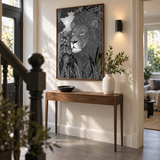 Black Lion Wall Art, framed on the wall of a welcoming hallway in a renovated UK terrace with a warm white wall and large plain grey floor tiles
