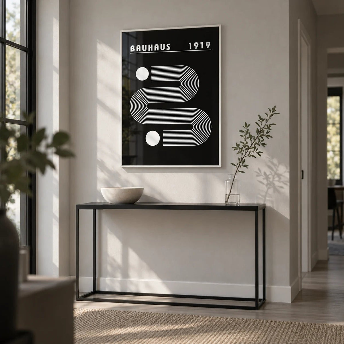 Black Minimalist Art, framed on the wall of a modern hallway with a pale grey wall