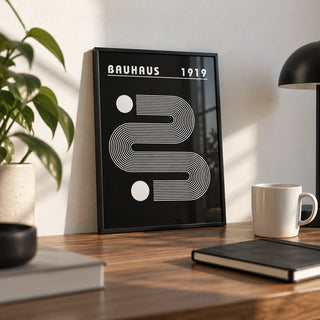 Black Minimalist Art, a small A4 framed print leaning on a walnut desk