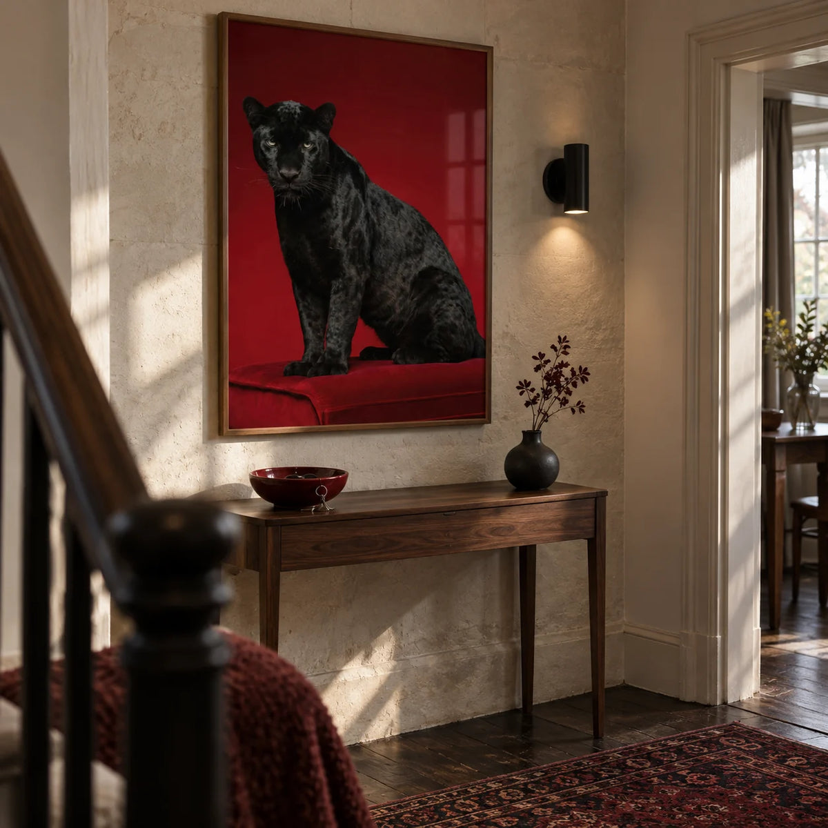 Black Panther Art Print, framed on the wall of a characterful hallway in a renovated UK terrace with a pale stone wall and dark timber floor