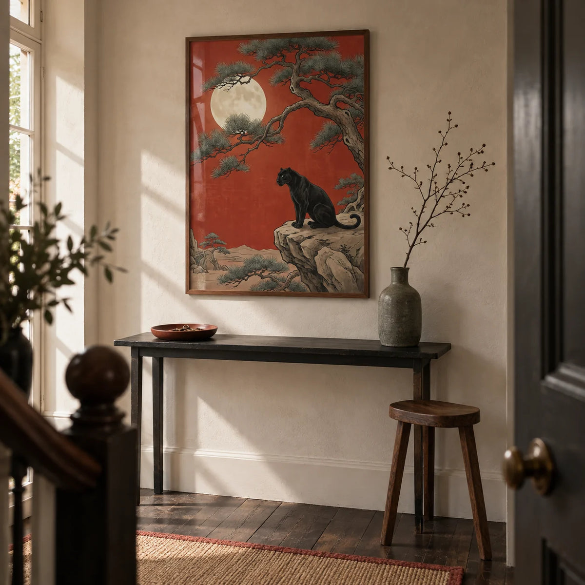 Black Panther Moon Print, framed on the wall of a characterful hallway in a UK terrace with pale stone-coloured plaster walls and dark timber floorboards