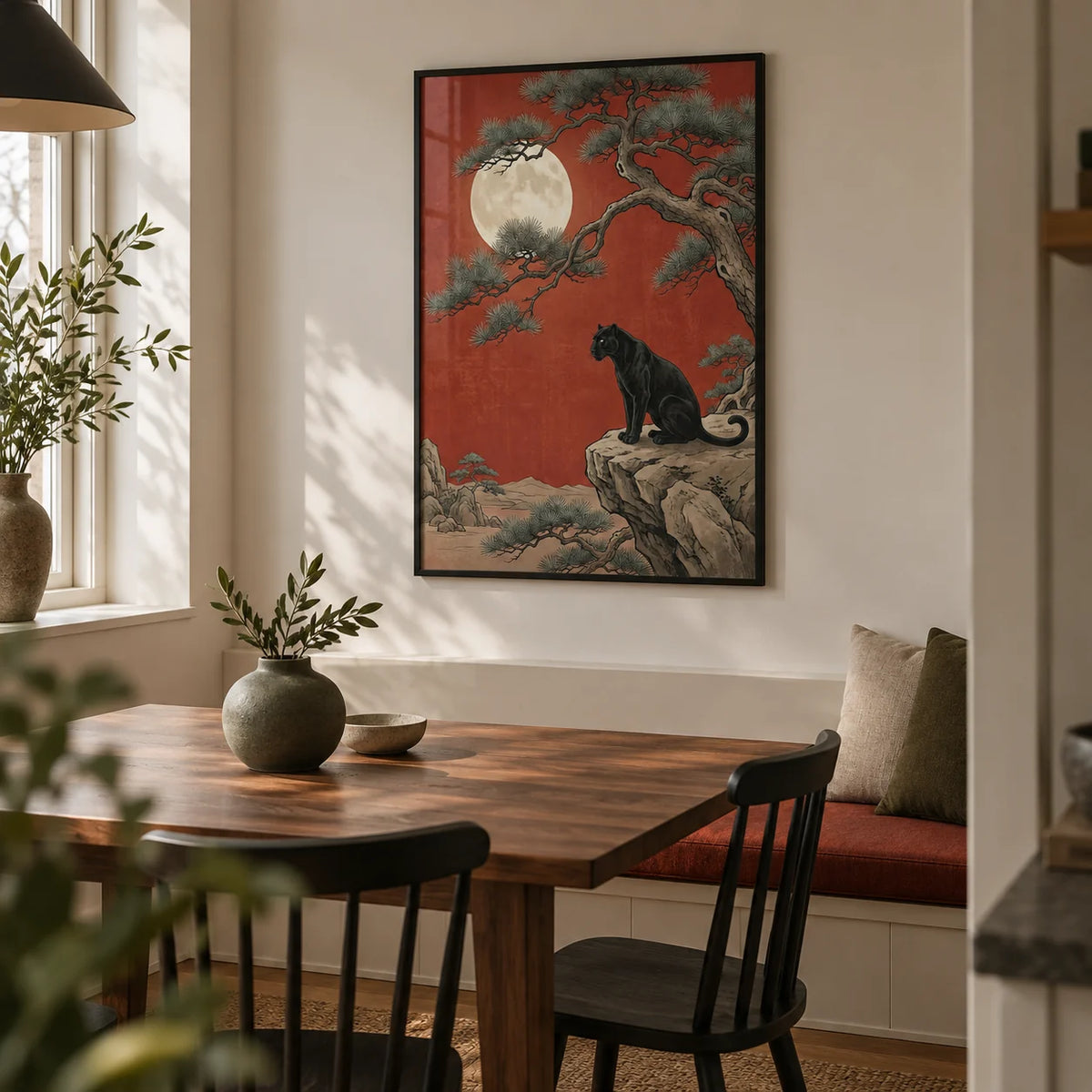 Black Panther Moon Print, framed on the wall of a compact modern dining room in a UK flat with a warm off-white wall and a built-in bench