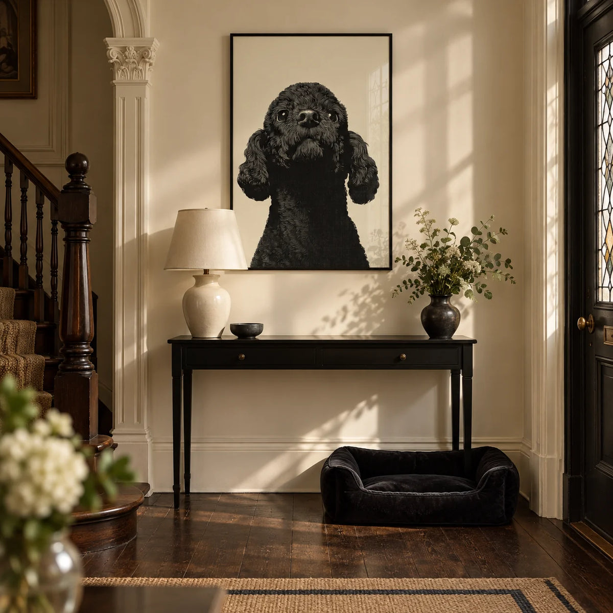 Black Poodle Art, framed on the wall of an elegant Victorian entrance hall with a warm cream wall and a dark wood floor