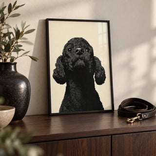 Black Poodle Art, a small A4 framed print leaning on a dark wood sideboard in a living room