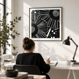 Black White Floral Art, framed on the wall of a bright design studio with a white wall in a home office