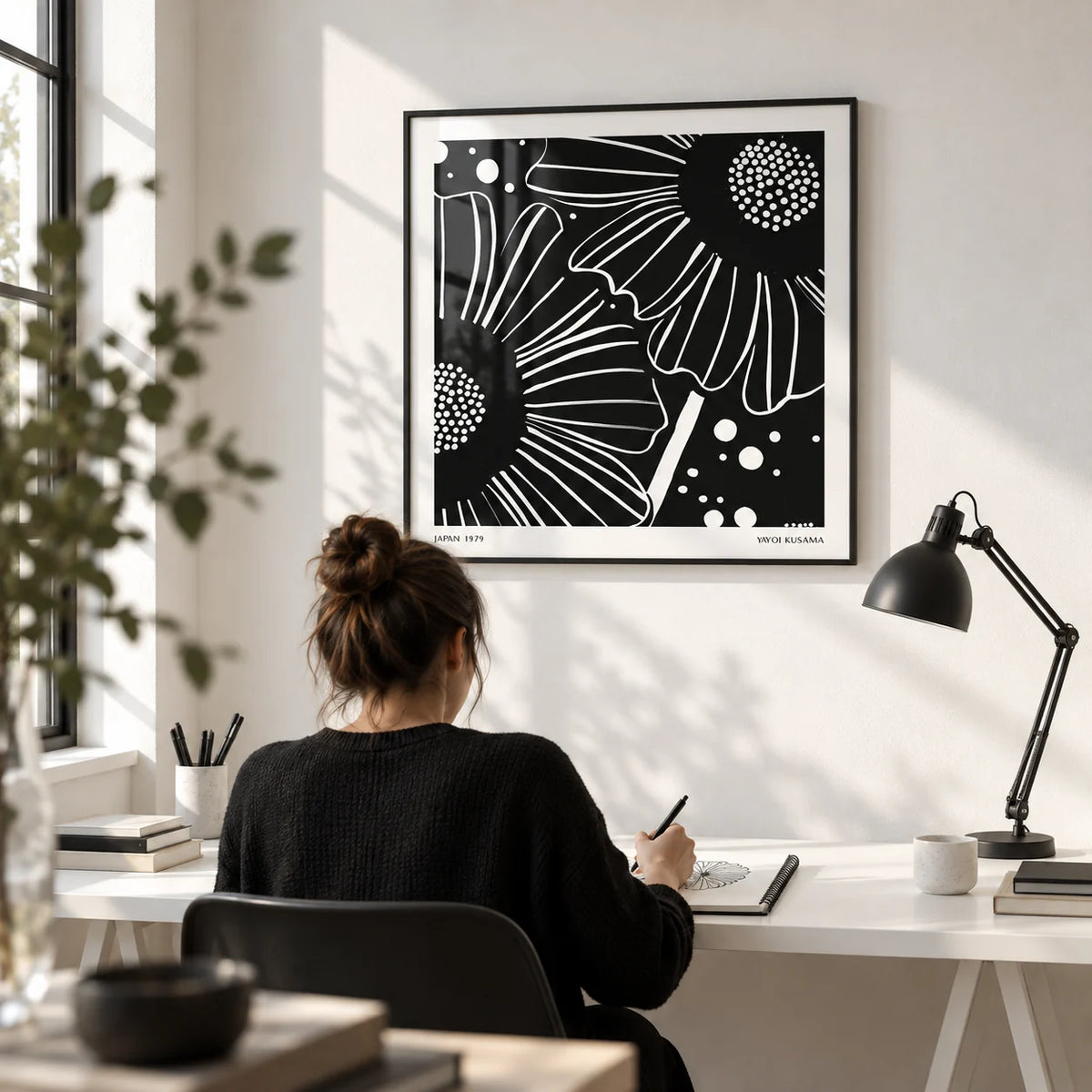 Black White Floral Art, framed on the wall of a bright design studio with a white wall in a home office