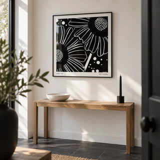 Black White Floral Art, framed on the wall of a crisp entrance hall with a white wall and a plain black slate floor