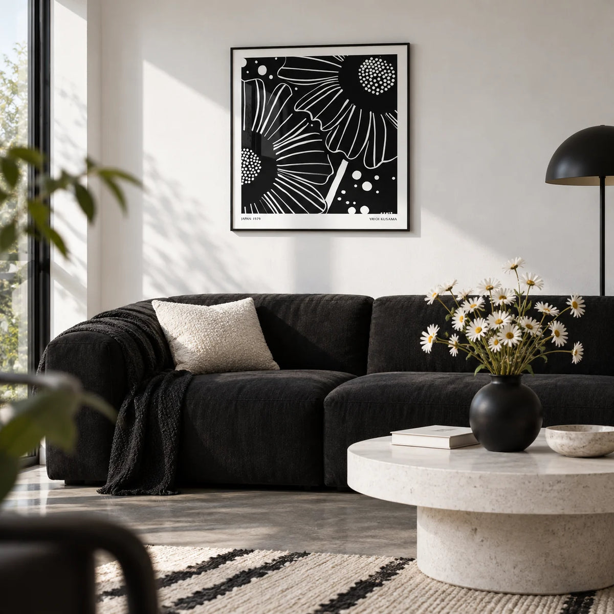 Black White Floral Art, framed on the wall of a design-led city flat living room with a white wall and a polished concrete floor