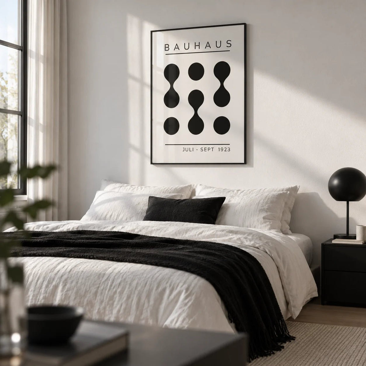 Black White Geometric Art, framed on the wall of a monochrome bedroom