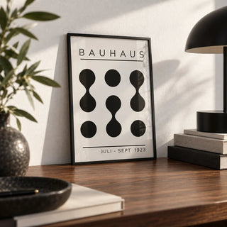 Black White Geometric Art, a small A4 framed print leaning on a walnut desk