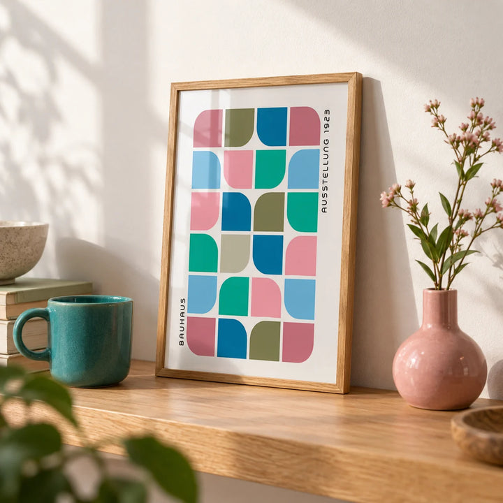 Block Colour Wall Art, a small A4 framed print leaning on an oak shelf in a living room