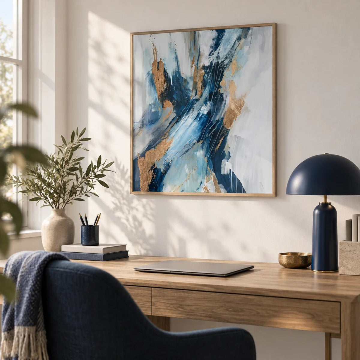 Blue Abstract Wall Art, framed on the wall of a calm home office with a white wall