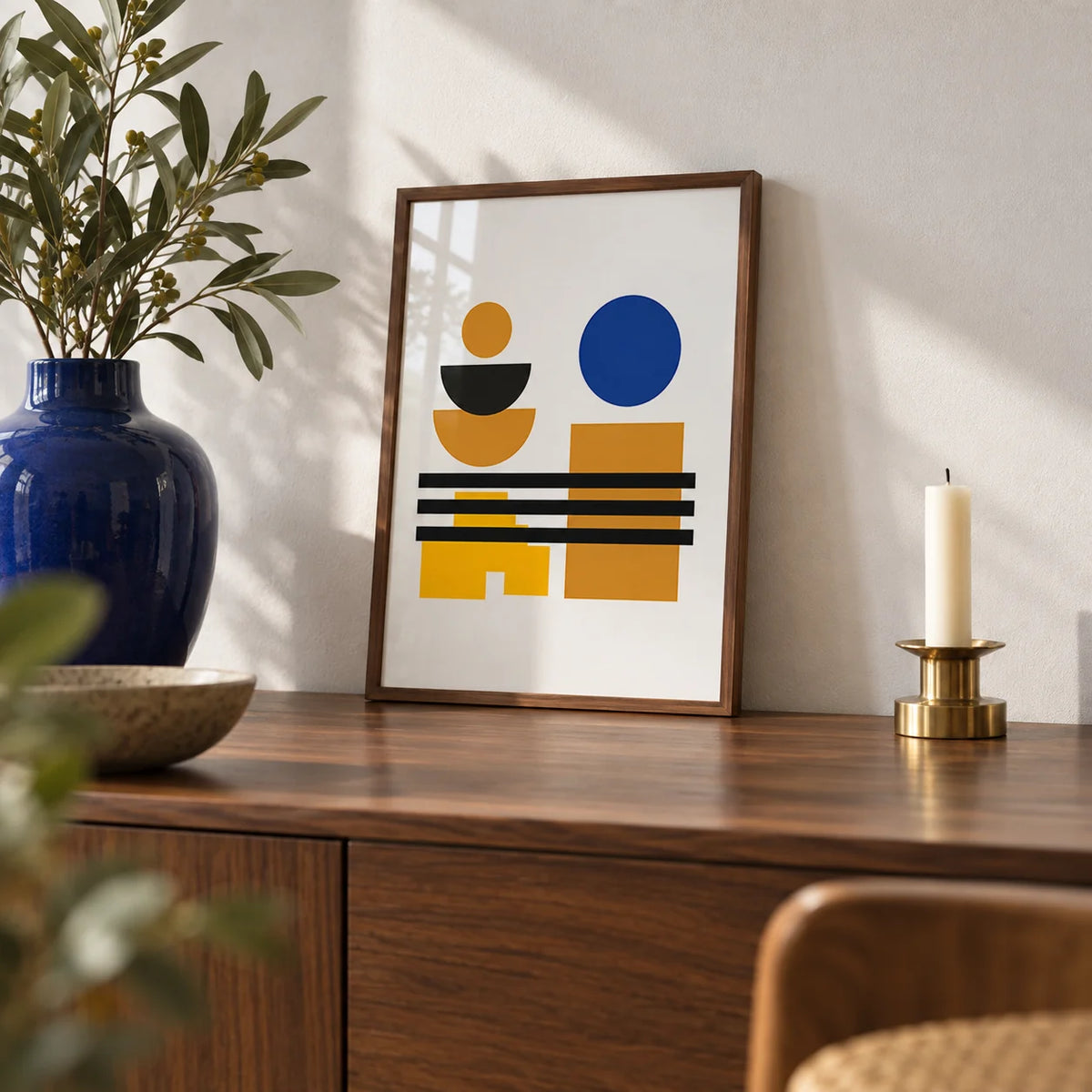 Blue and Brown Wall Art, a small A4 framed print leaning on a walnut sideboard in a living room