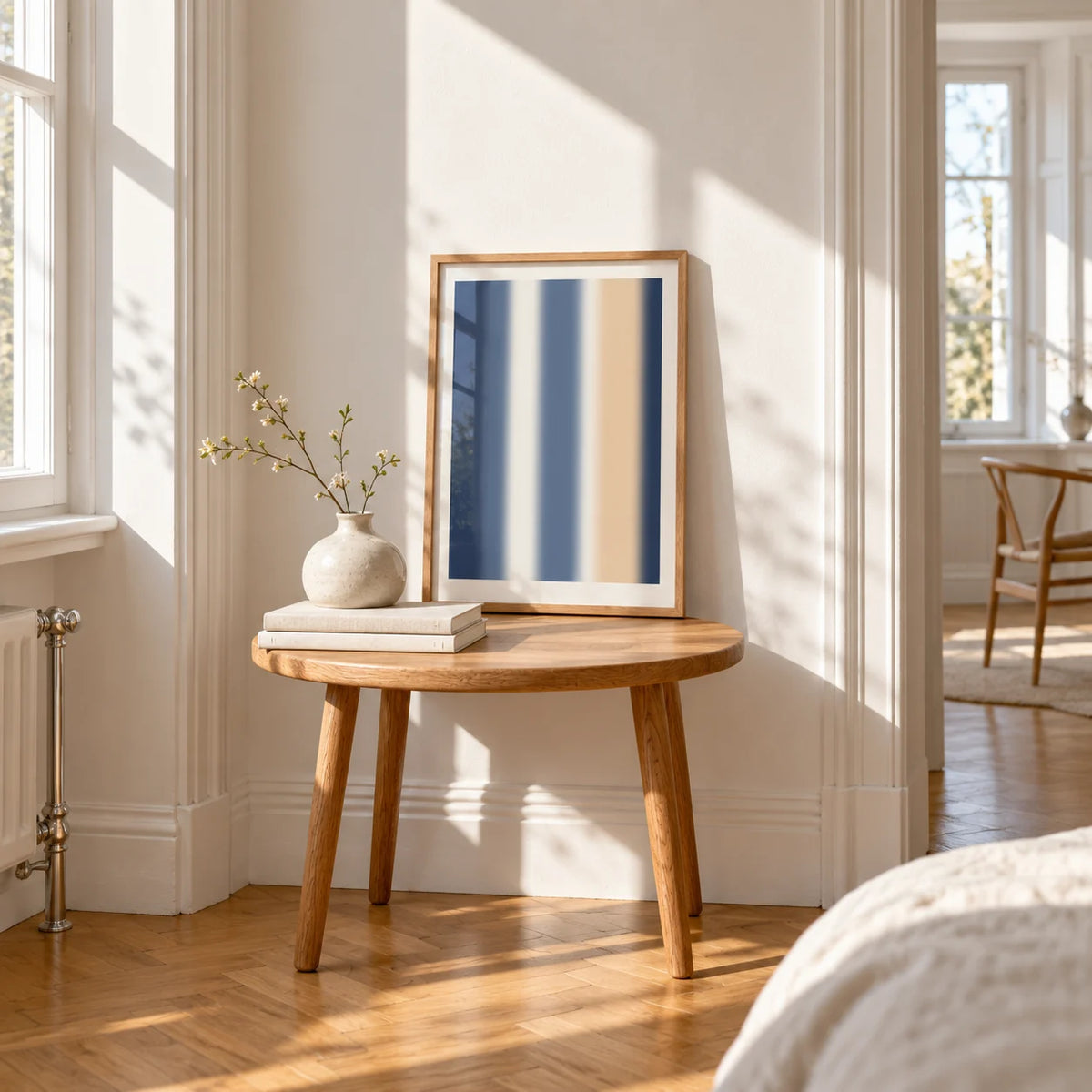 Blue and Cream Wall Art, a small A4 framed print leaning on a small solid oak side table