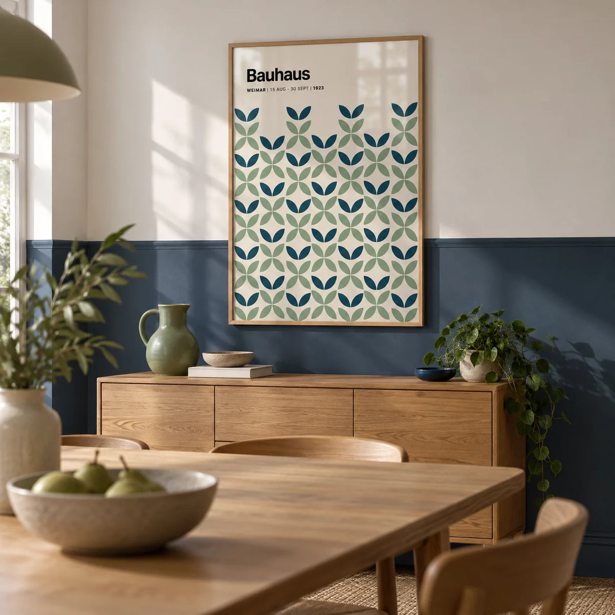 Blue and Green Wall Art, framed on the wall of a dining room with a plain navy painted lower wall and white above