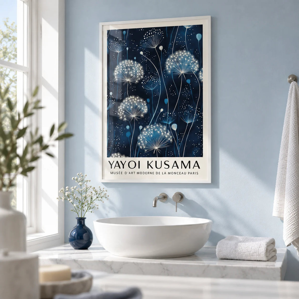 Blue and White Wall Art, framed on the wall of a calm white bathroom with a pale blue painted wall