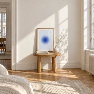 Blue Aura Poster, a small A4 framed print leaning on a small solid oak side table