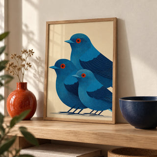 Blue Bird Art Print, a small A4 framed print leaning on a pale oak shelf in a living room