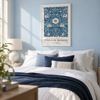 Blue Botanical Prints, framed on the wall of a calm bedroom with a pale baby blue painted wall