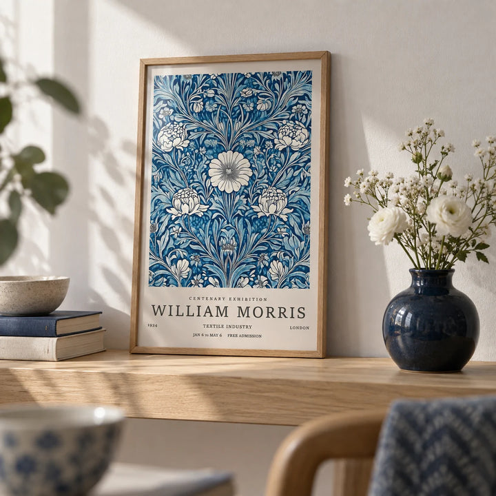 Blue Botanical Prints, a small A4 framed print leaning on a pale oak shelf in a living room