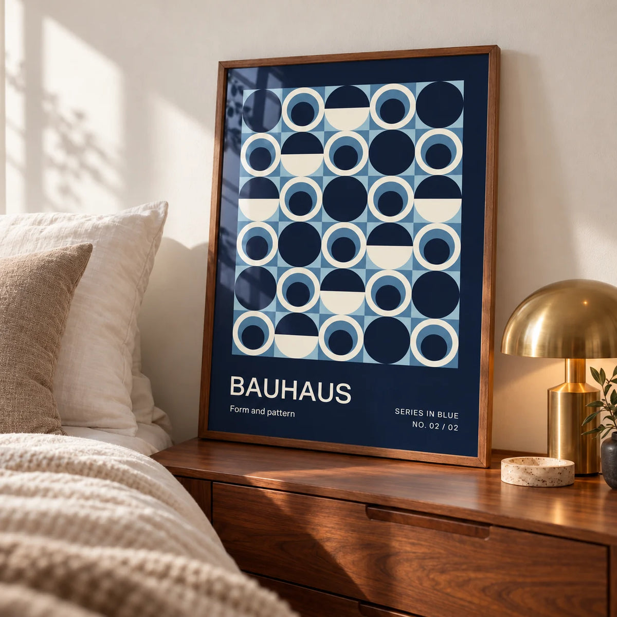 Blue Circles Wall Art, a framed print leaning on a walnut bedside chest in a calm mid-century bedroom