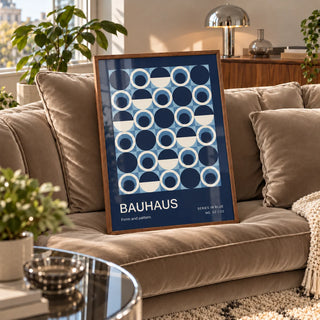 Blue Circles Wall Art, a framed print leaning on a velvet sofa in a living room