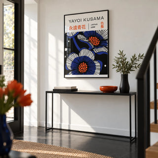 Blue Flower Poster, framed on the wall of a crisp hallway with a white wall and a black floor