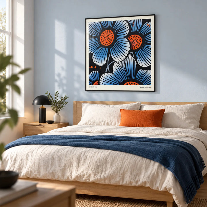 Blue Flower Wall Art, framed on the wall of a crisp modern bedroom with a pale blue wall and a light oak floor