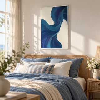 Blue Flowing Wall Art, framed on the wall of a light coastal bedroom