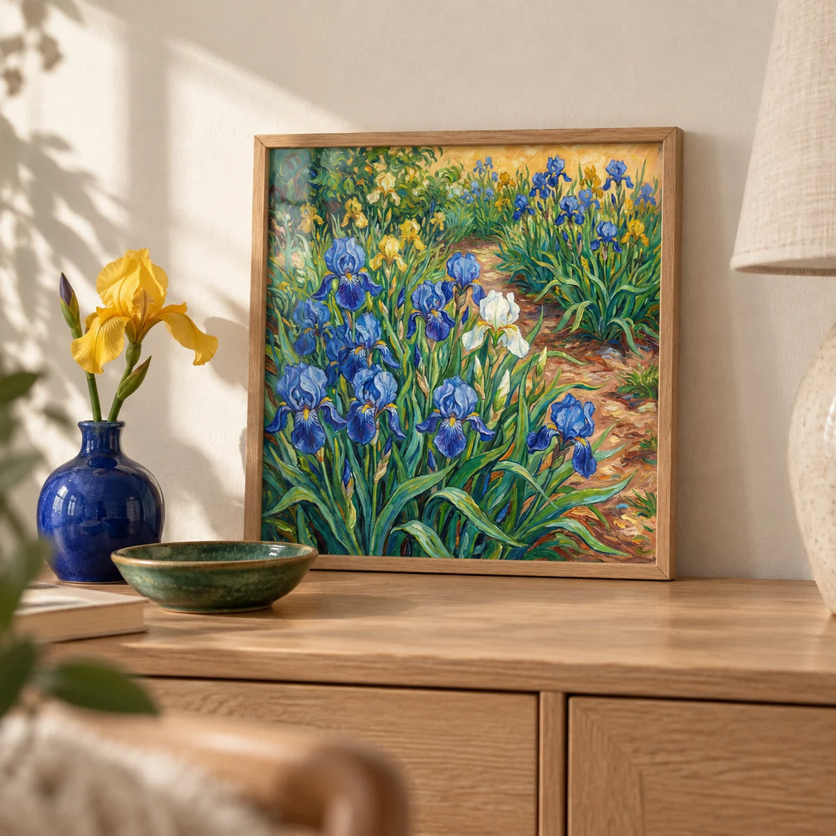 Blue Iris Art Print, a small A4 framed print leaning on a pale oak sideboard in a living room