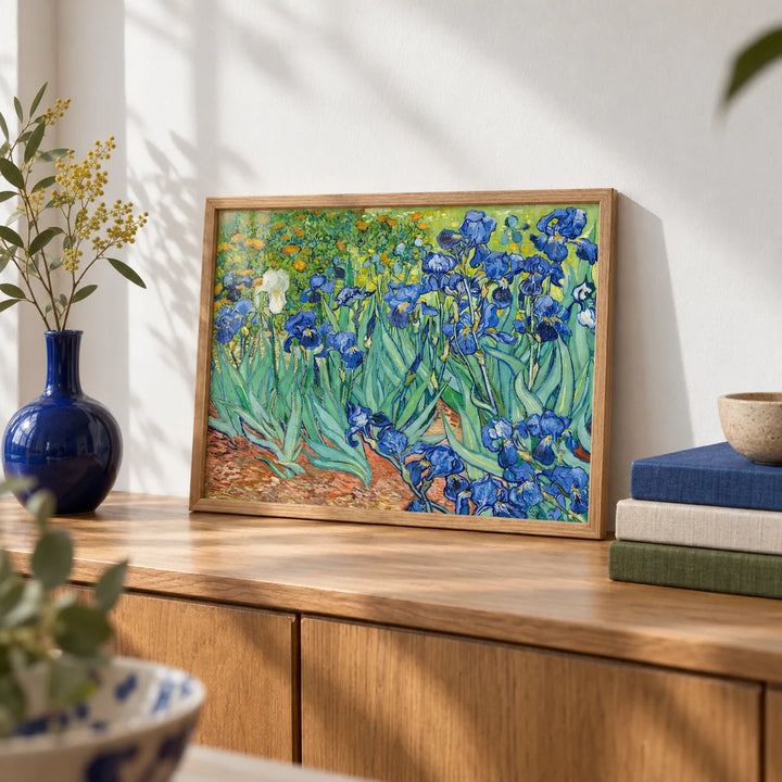Blue Iris Wall Art, a small A4 framed print leaning on an oak sideboard in a living room