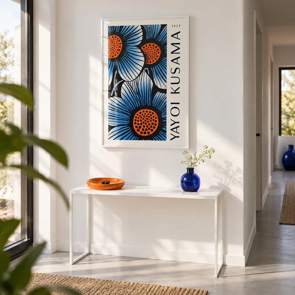 Blue Living Room Wall Art, framed on the wall of a bright modern hallway with a white wall and a pale grey floor