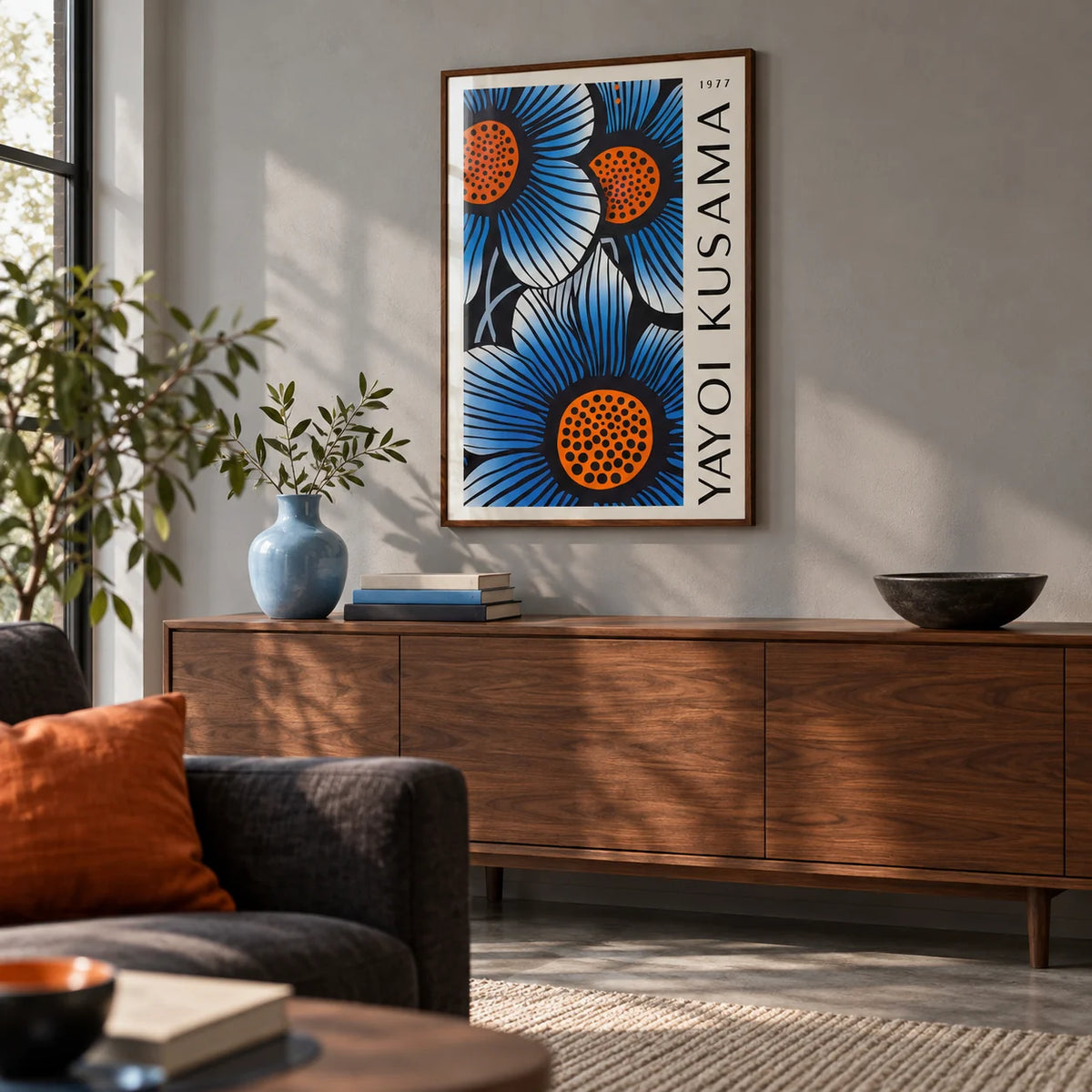 Blue Living Room Wall Art, framed on the wall of a calm design-led living room with a soft grey wall and a concrete floor
