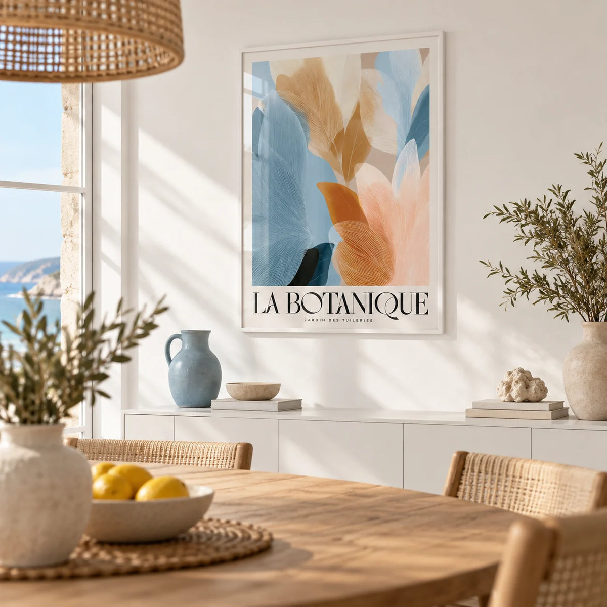 Blue Pink Wall Art, framed on the wall of a bright coastal dining room with a white wall
